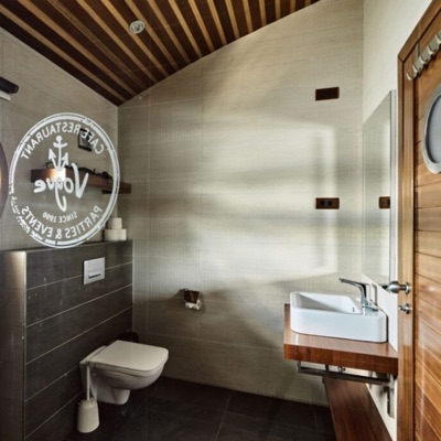 Modern bathroom with the Vogue logo on the shower glass